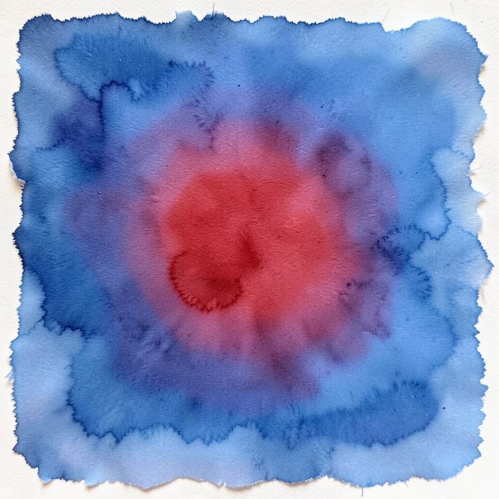 Watercolor painting of layered blue and twilight-toned fabric swatches fanned out on a soft background